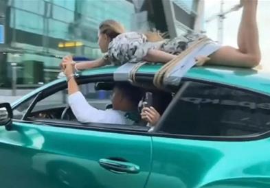 Видео:Руски инфуенсер ја врзал својата девојка за покривот на автомобилот и ја возел низ градот