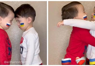 Двегодишни близначиња со руско и украинско знаме повикуваат на мир (ВИДЕО) 