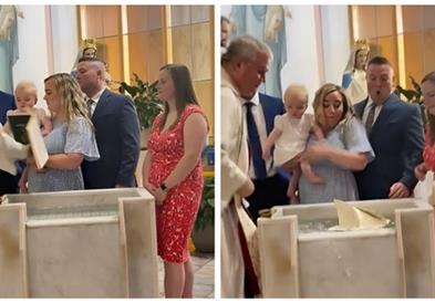 Бебе стана хит на социјалните мрежи- додека го крстеа, му ја турна Библијата на попот (ВИДЕО)