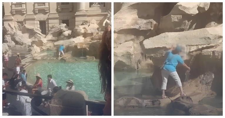 Туристка се искачи на фонтаната Треви во Рим за да наполни вода, Италијанците шокирани (ВИДЕО)